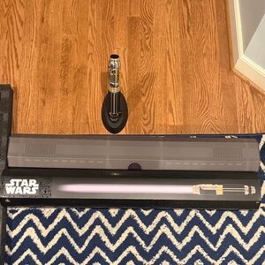 official Star Wars Silver Lightsaber Display. Kept in box so in great condition